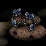 Boucles d'Oreilles Papillon Argent plaqué au rhodium noir avec zircons bleus - Rêve de Papillon