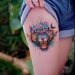 Tatouage éphémère tigre et papillon style aquarelle sur jambe de femme- Rêve de Papillon