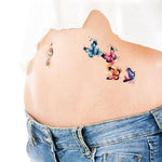 Tatouage éphémère papillon aquarelle sur ventre - Rêve de Papillon